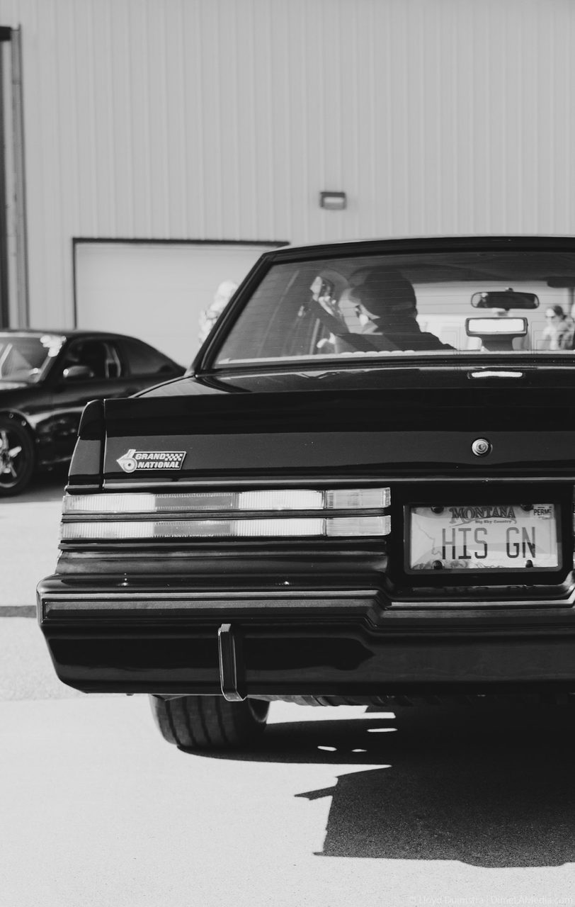 Black and white rear of a Buick Grand National with HIS GN plate
