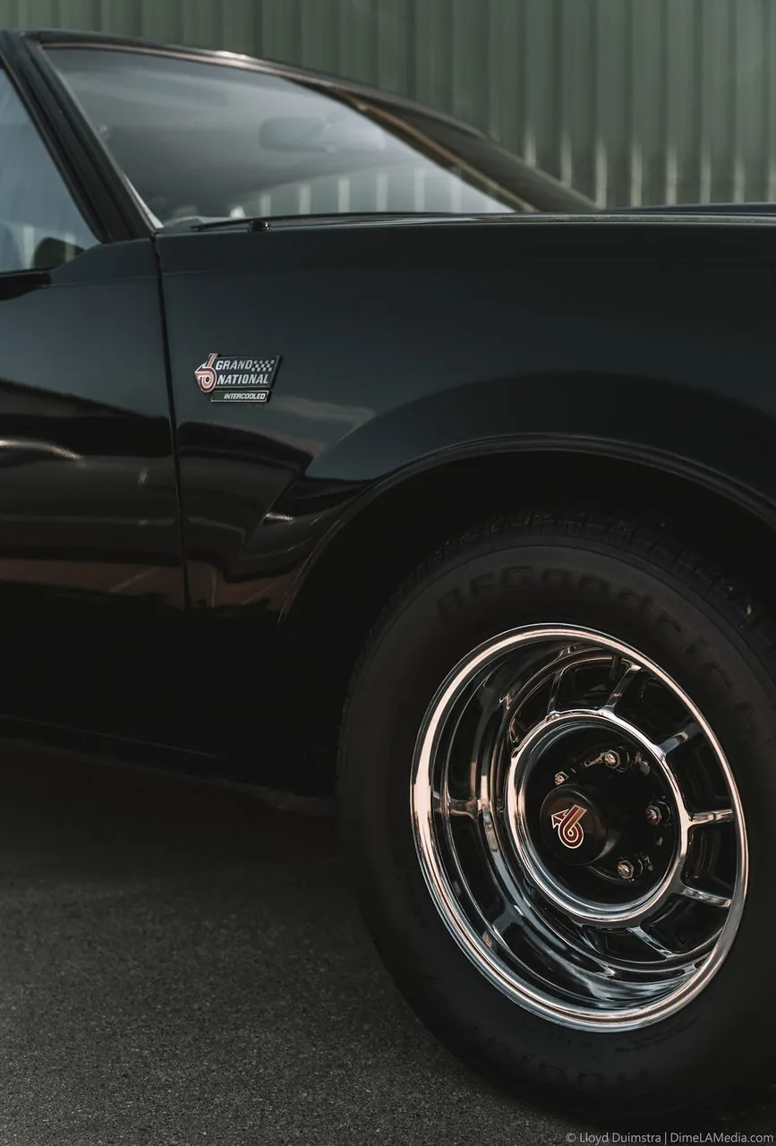 Black Buick Grand National side with chrome wheel and intercooled badge