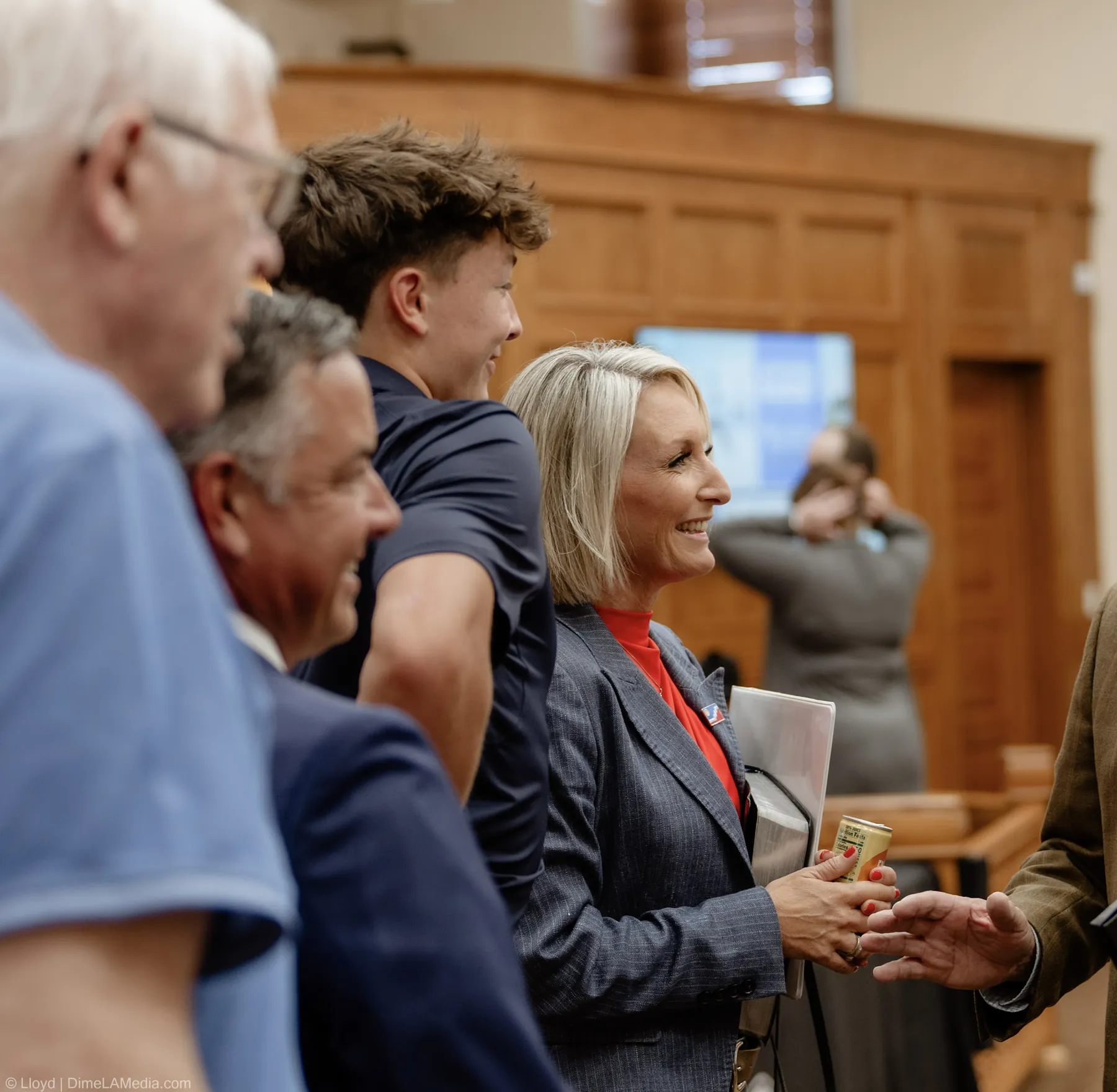 Christine Erickson smiles while greeting supporters before taking the oath of office