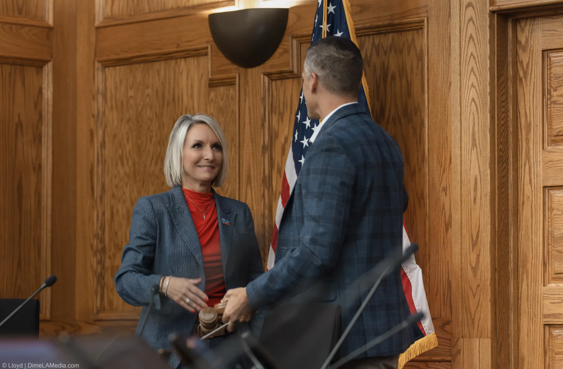 Christine Erickson smiles as she receives the gavel from Paul TenHaken