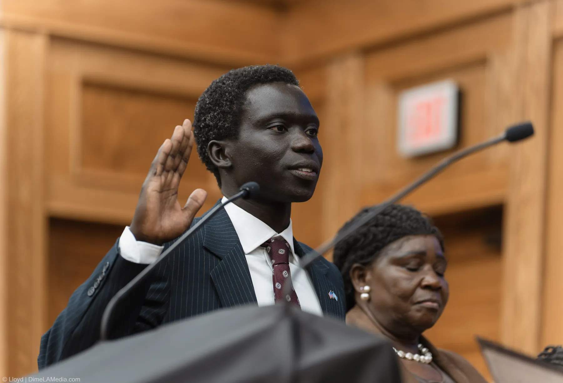 Close frame of Zak Okuwe taking the council oath of office at Carnegie Town Hall