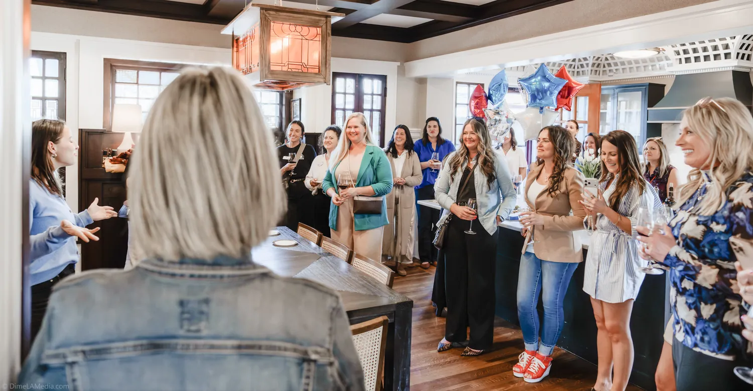 A large group of supporters gathers indoors for a Christine Erickson campaign event in Sioux Falls