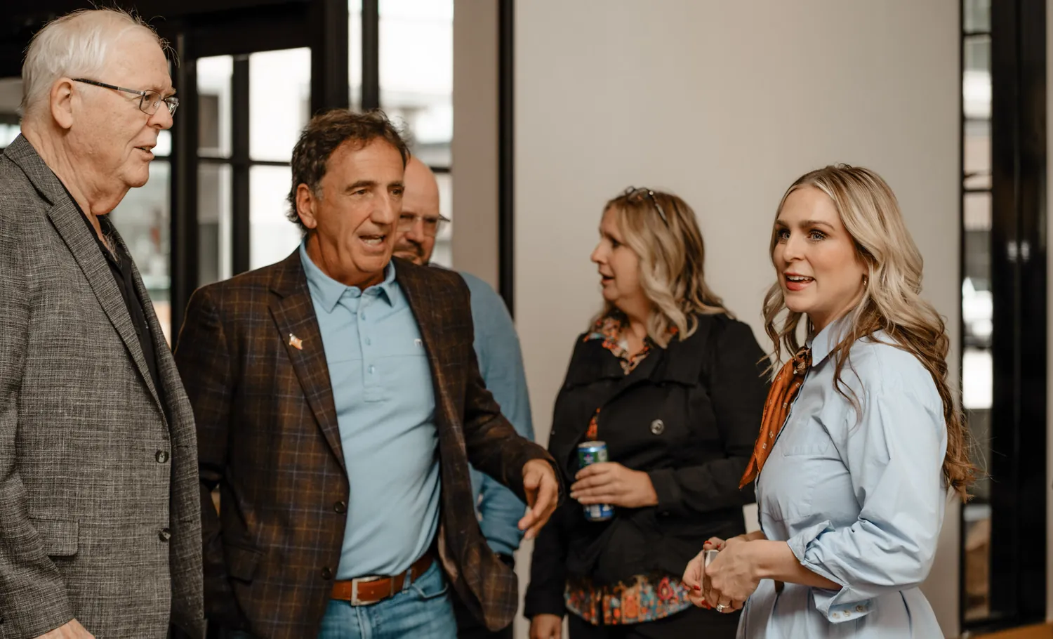 Supporters mingle at a Christine Erickson campaign gathering in Sioux Falls