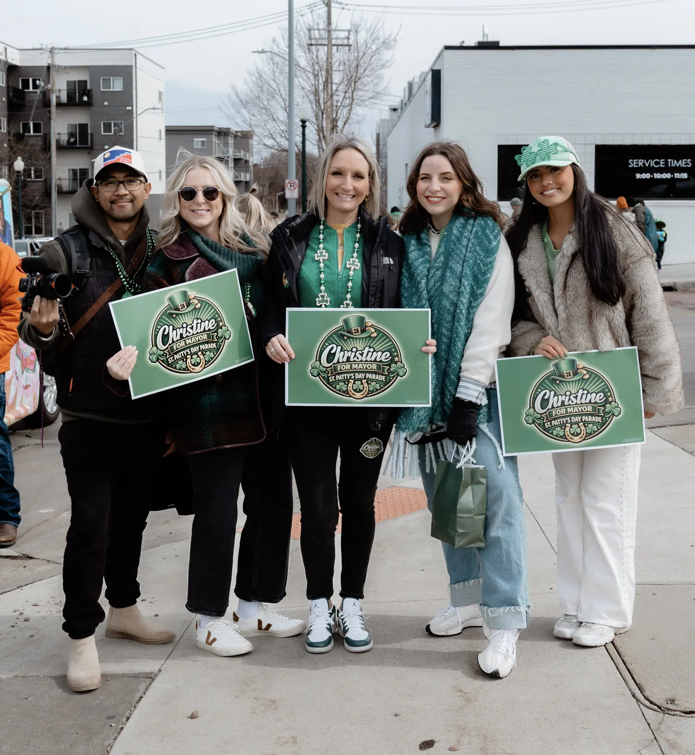 Supporters hold Christine Erickson campaign signs on the street in Sioux Falls during the campaign