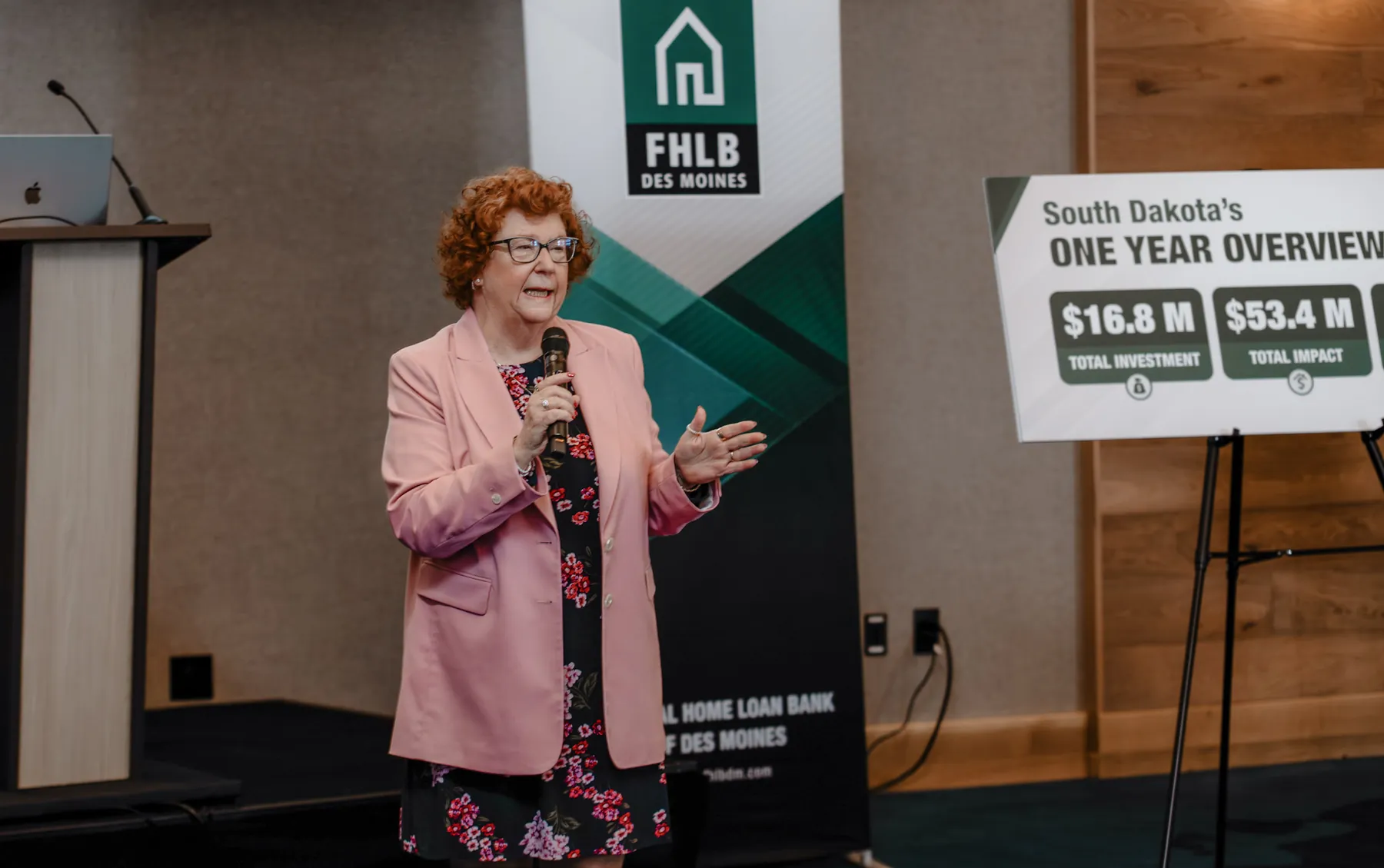 Speaker presenting on stage at a Sioux Falls corporate conference