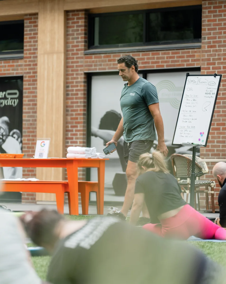 Outdoor Kinstretch class hosted by Sisu and Pomegranate Market, photographed by Lloyd Duimstra at Cherapa Place in downtown Sioux Falls SD