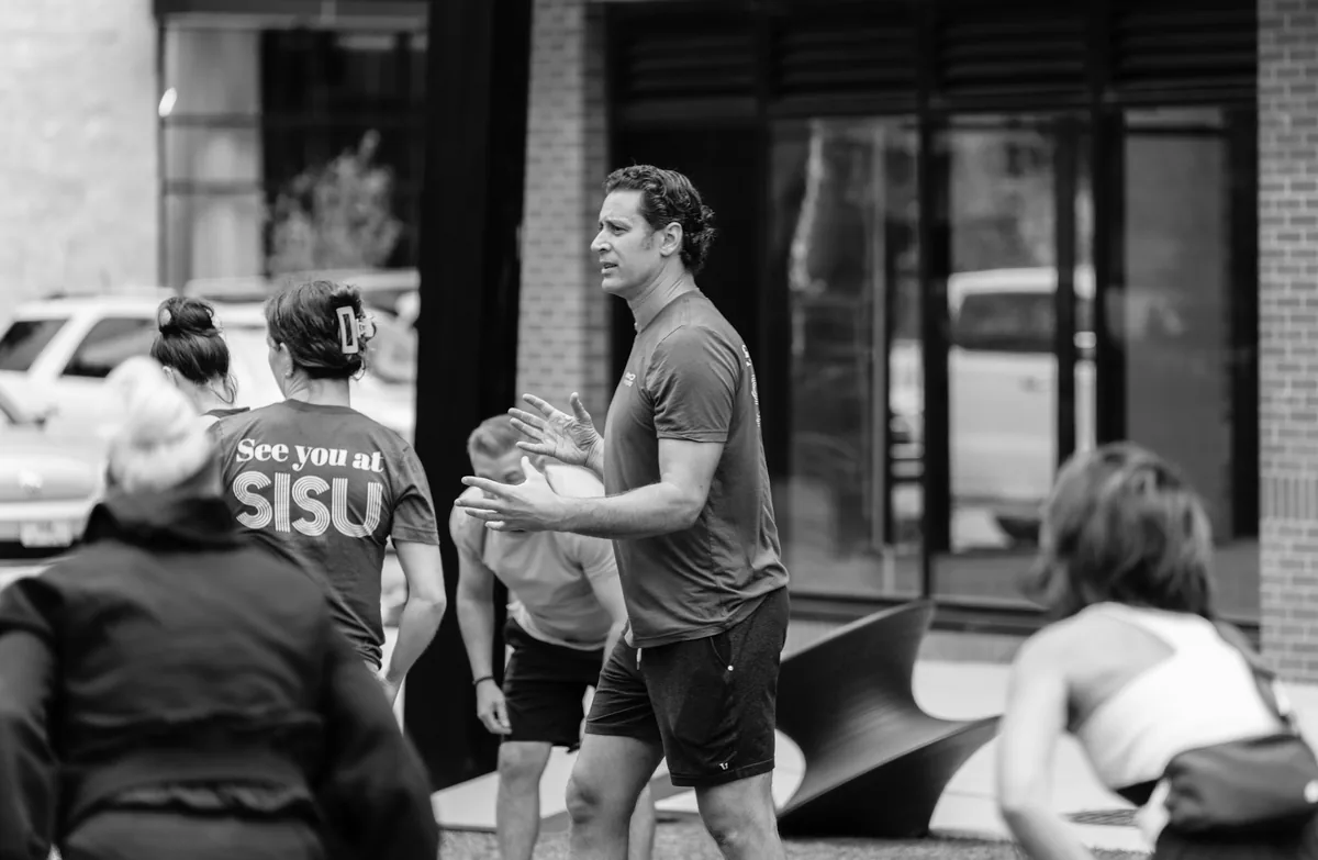 Outdoor Kinstretch class hosted by Sisu and Pomegranate Market, photographed by Lloyd Duimstra at Cherapa Place in downtown Sioux Falls SD