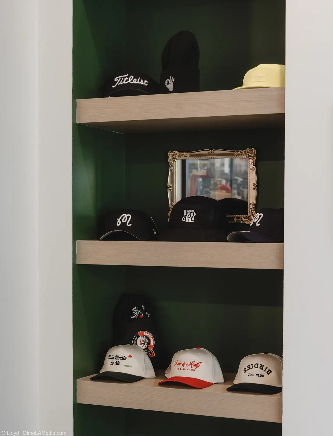 Arched shelf niche of golf hats at Final Drive in Sioux Falls