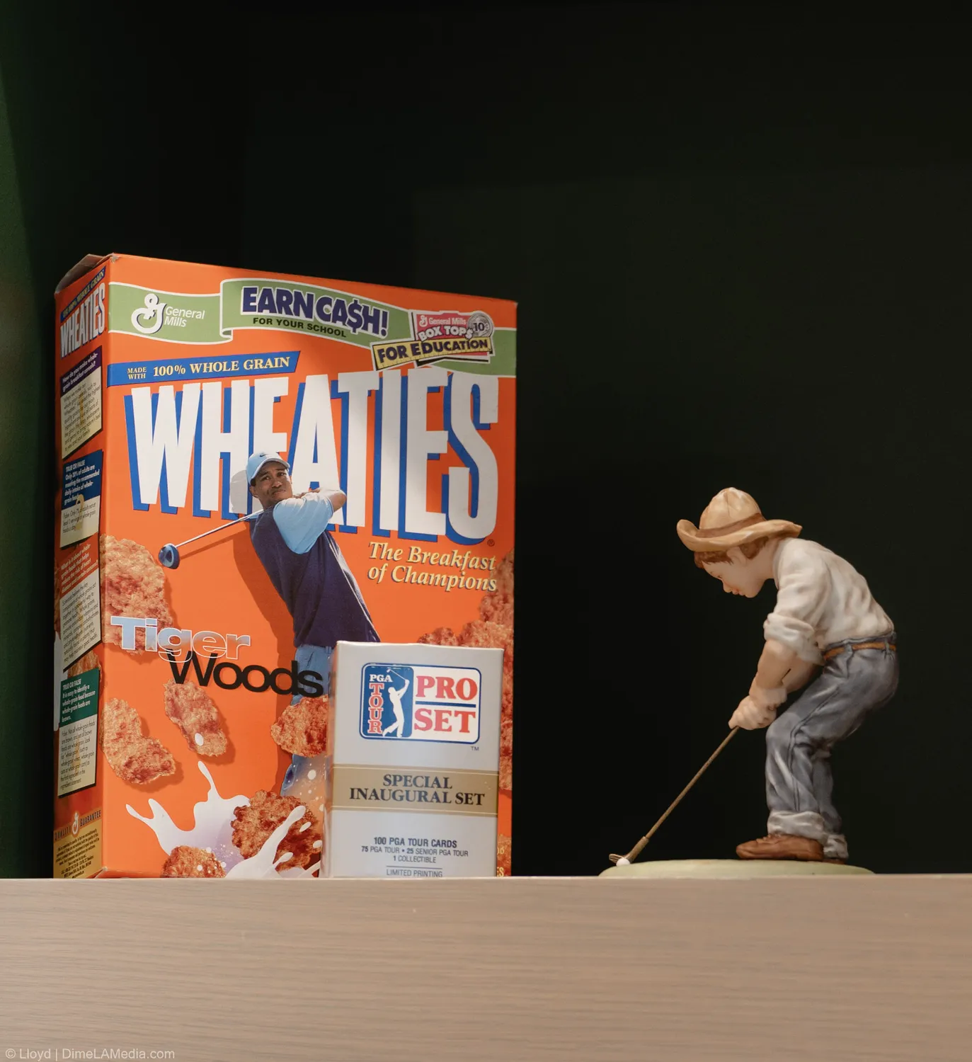 Vintage Tiger Woods Wheaties box and putting figurine on display at Final Drive