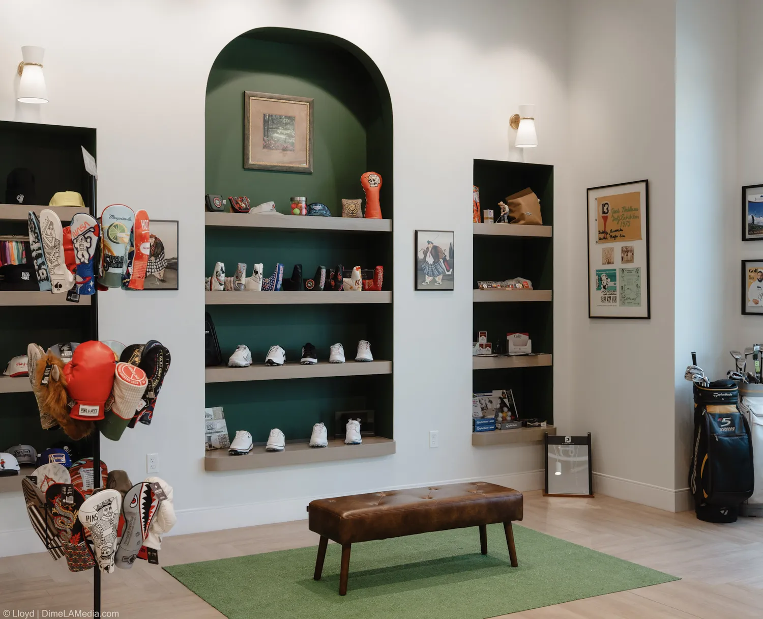 Shelves of golf headcovers, shoes, and accessories inside Final Drive in the Steel District
