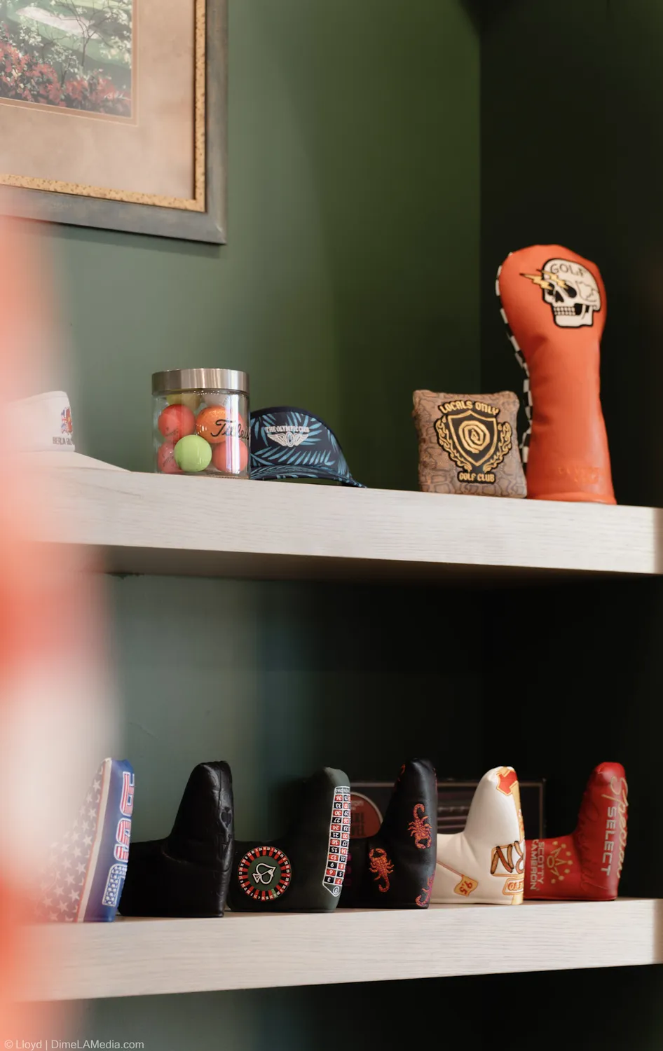 Shelf of collectible golf headcovers at Final Drive
