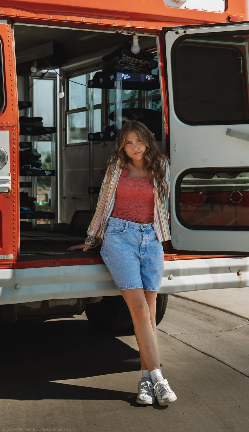 Maddie Theisen at the open doors of the True Vintage bus, a branding shoot in Sioux Falls