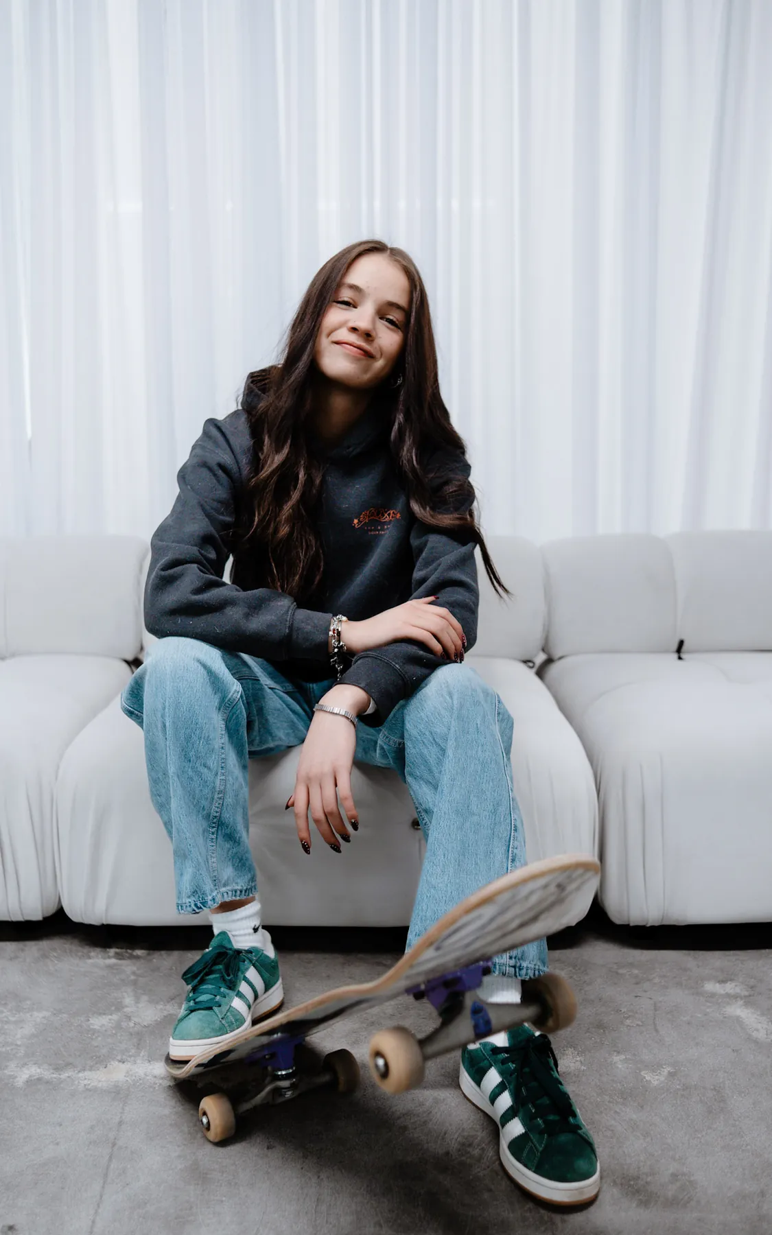 Studio portrait with a skateboard
