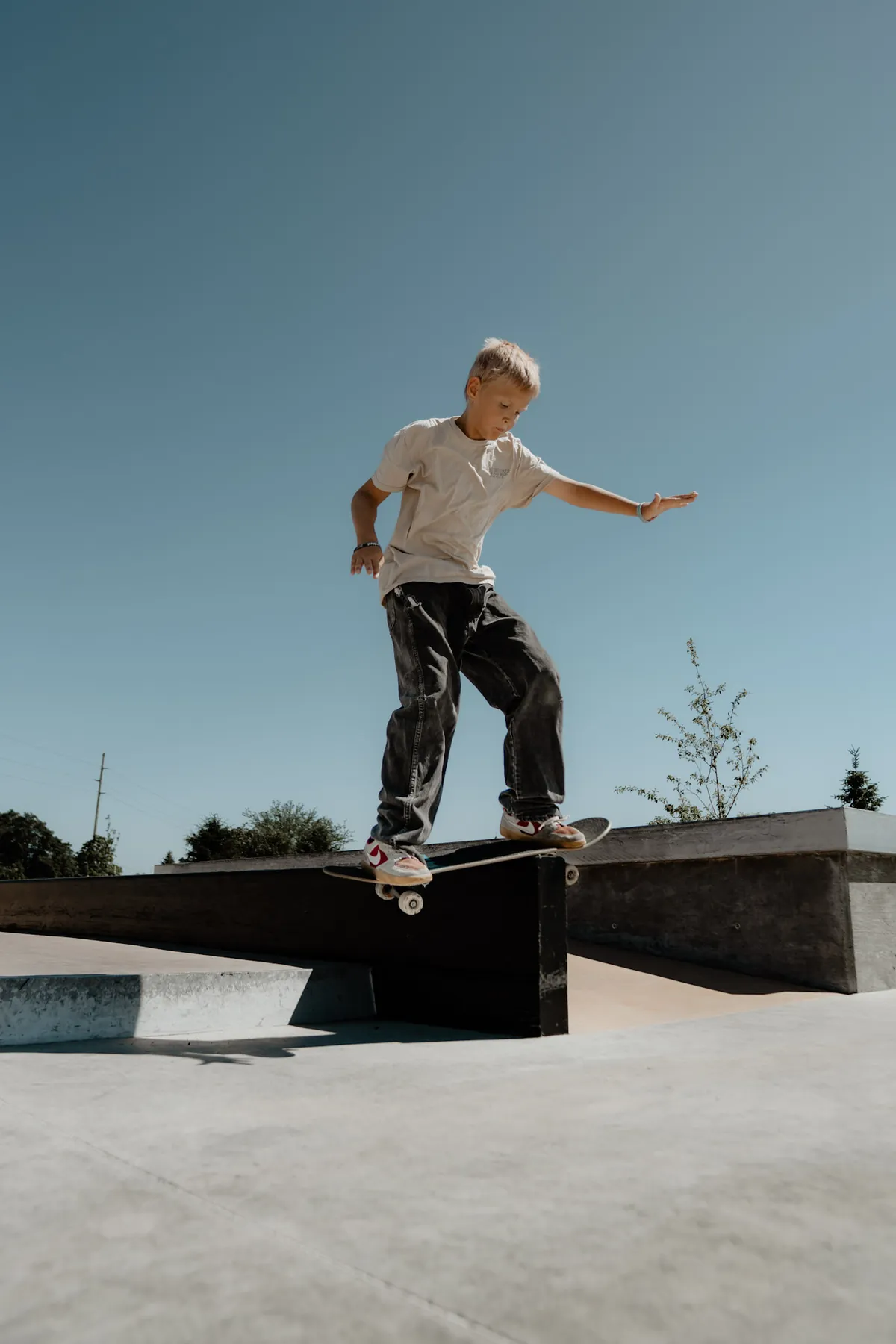 Kid catching his first airs at the skatepark
