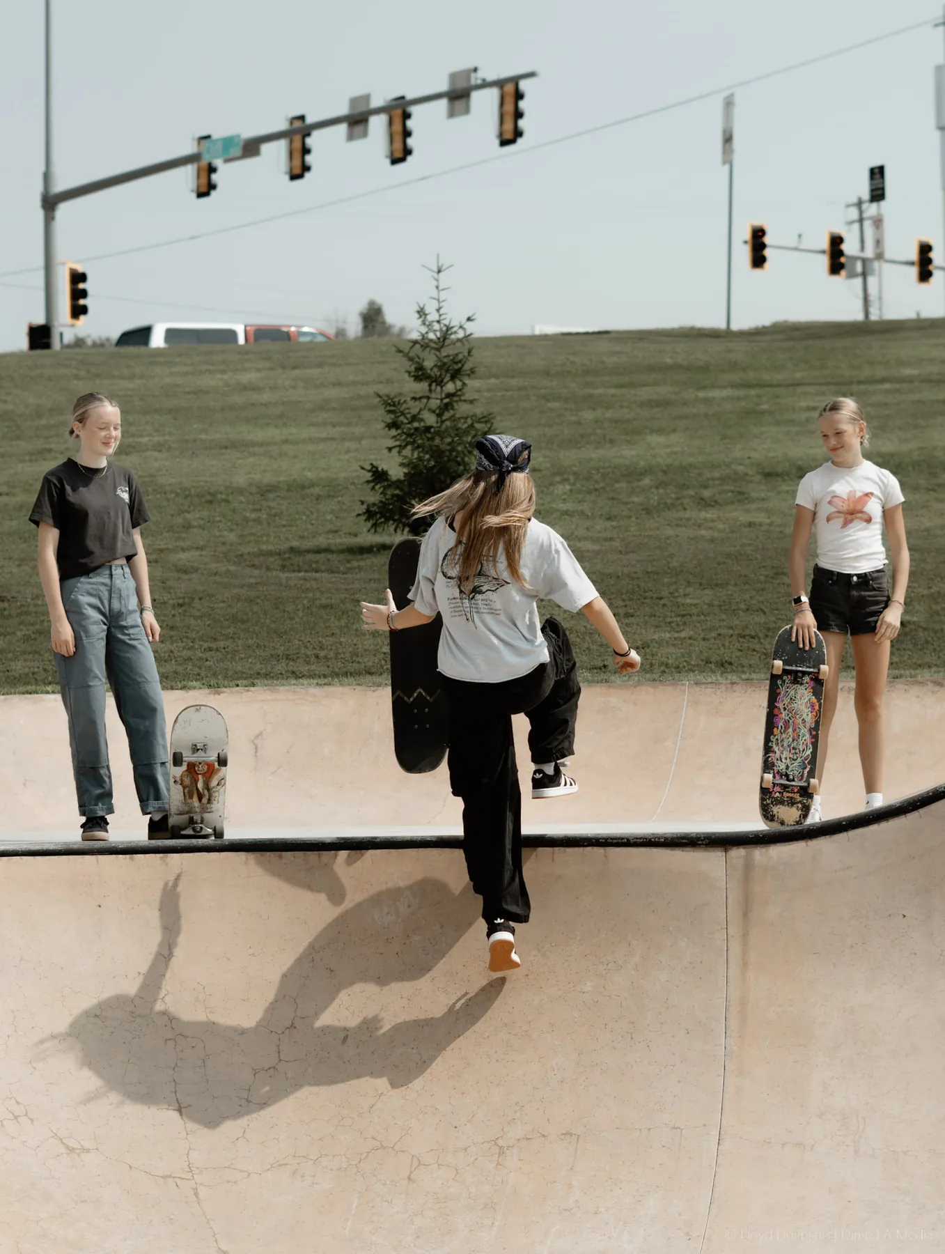 Skaters lined up along the bowl at a local contest