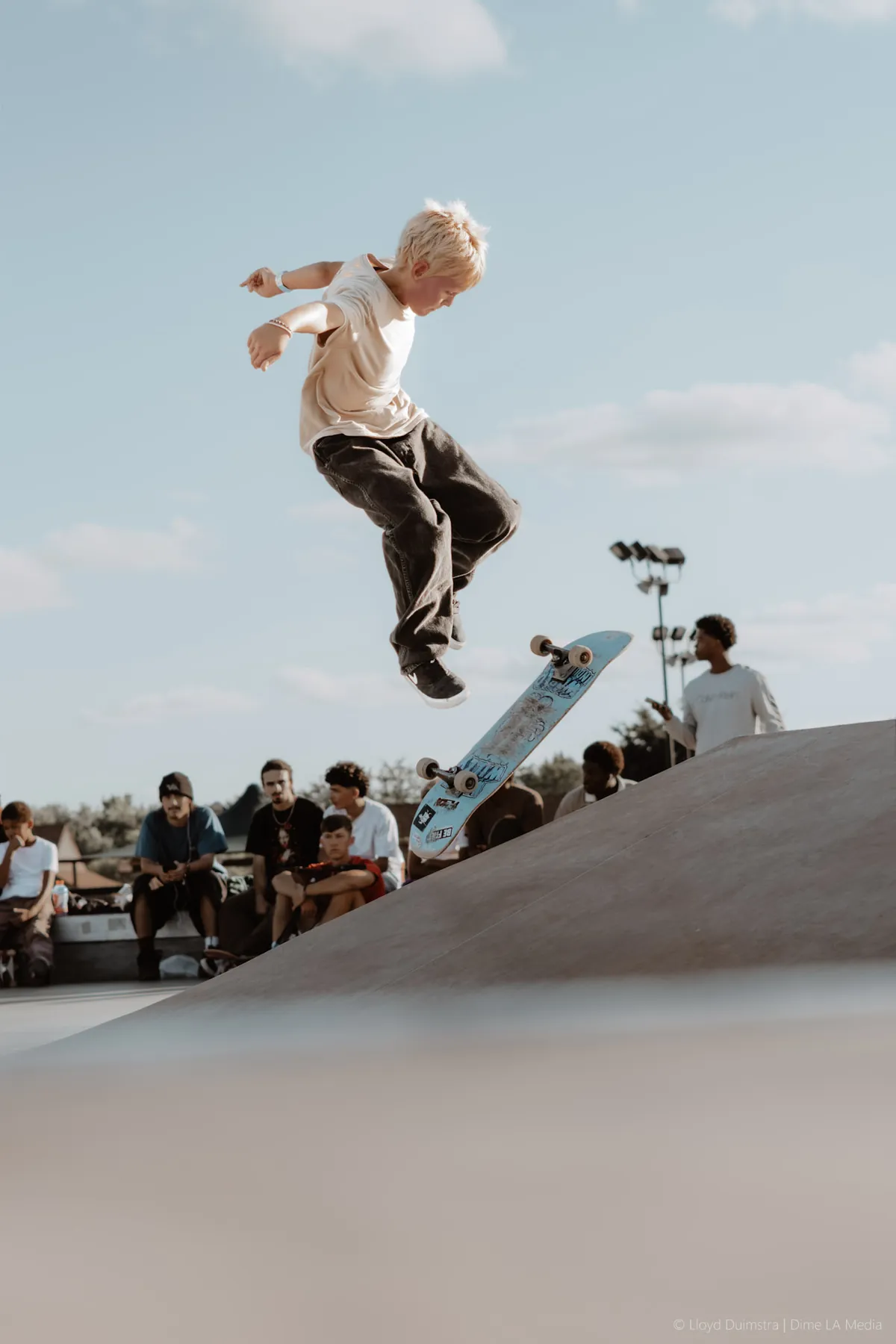 Young skater catching air off the quarterpipe