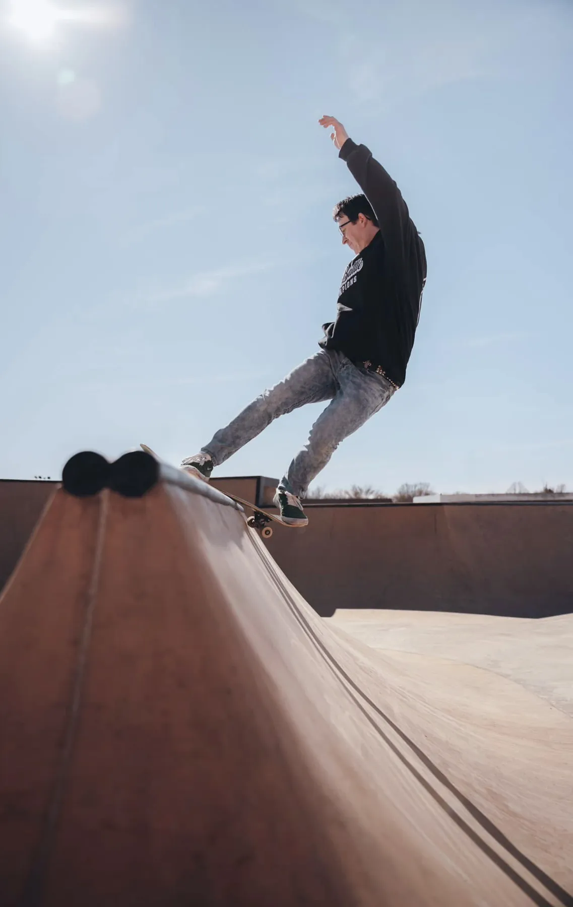 Skateboarder locked into a rock to fakie