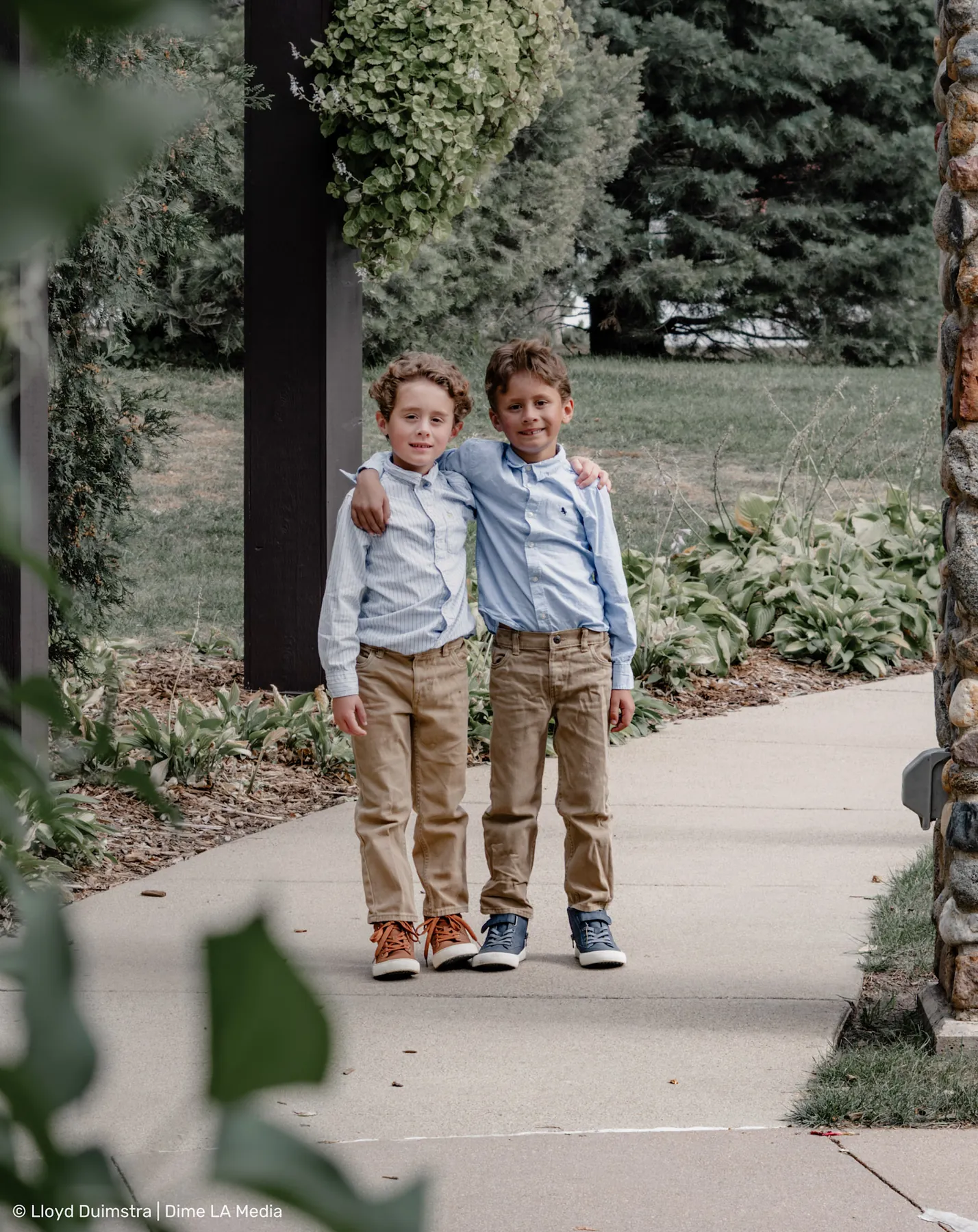 Brothers arm in arm on a garden sidewalk, Sioux Falls SD