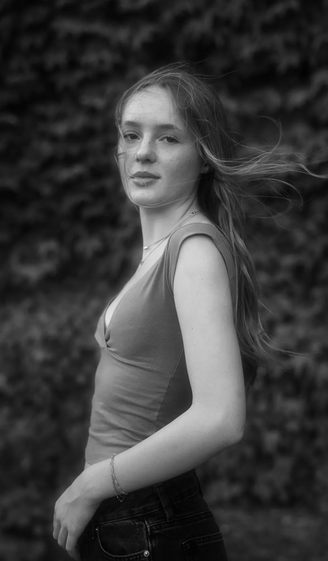 Black and white senior portrait with wind in her hair, Sioux Falls SD