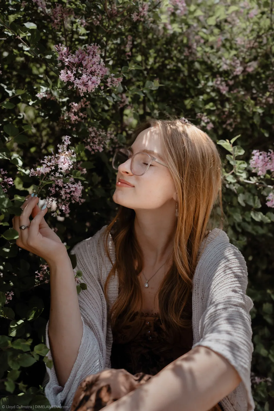 Syd Patzwald spring senior portrait among lilacs, Sioux Falls SD