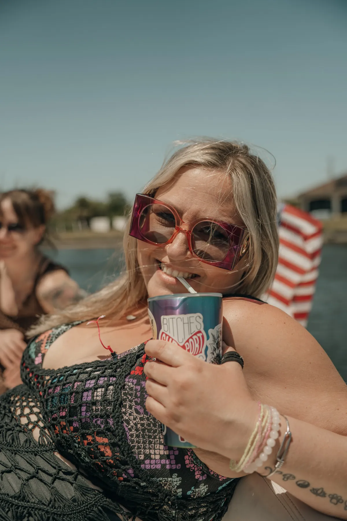 Summer portrait of a woman laughing on a boat