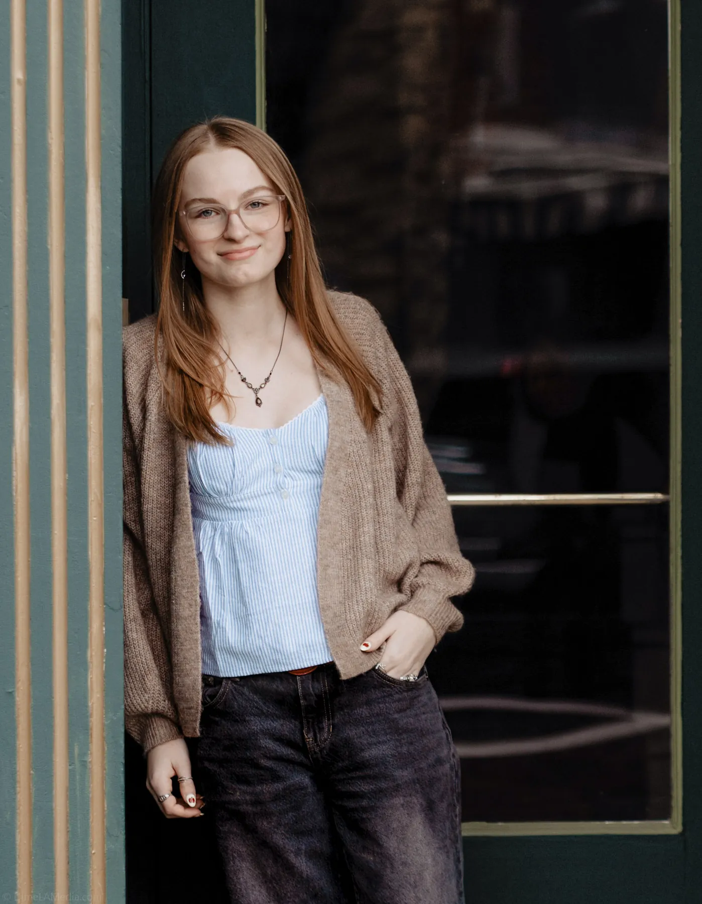 Syd Patzwald leaning in a doorway on a downtown Sioux Falls street