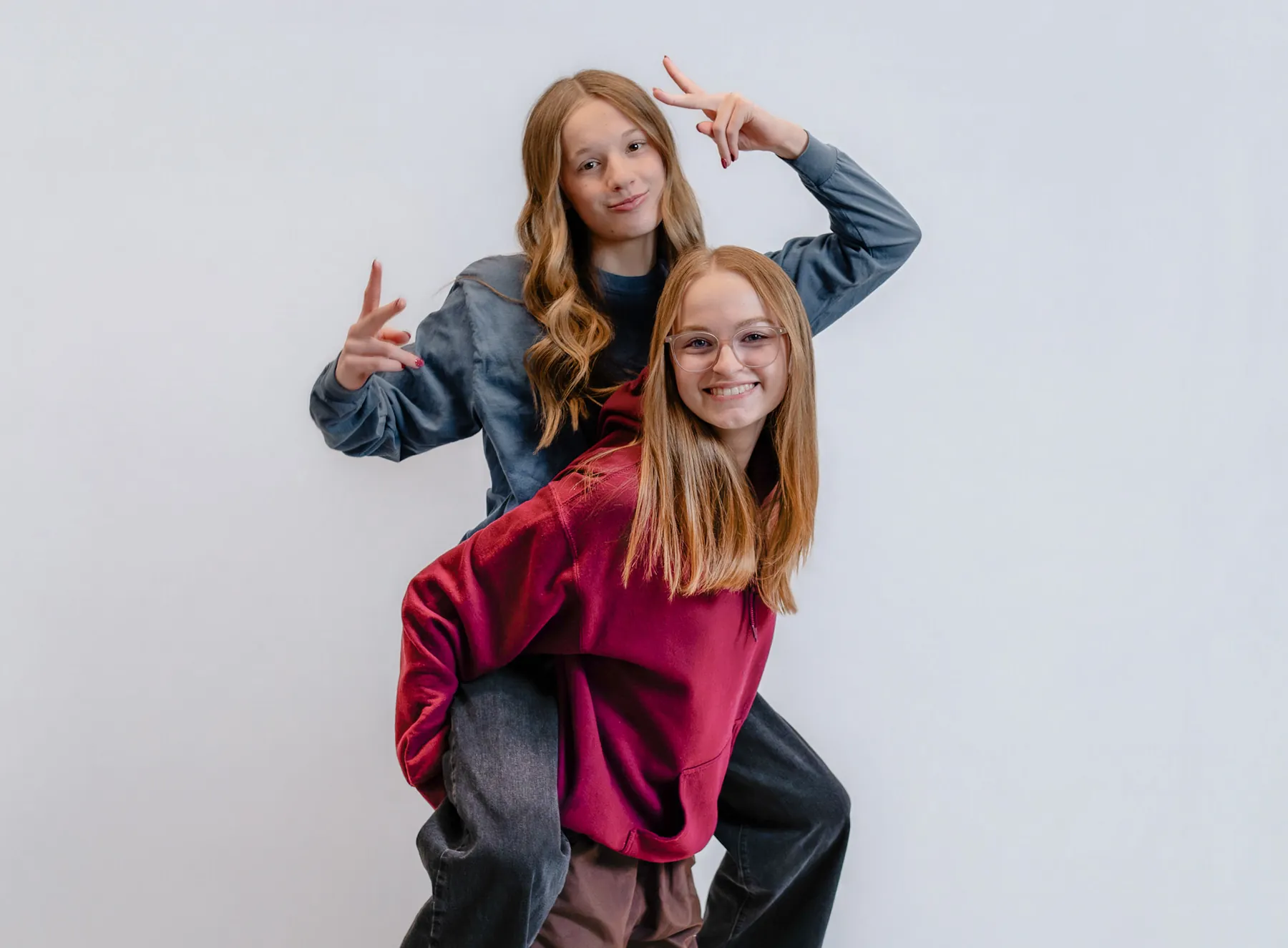 Studio session of Syd Patzwald and a friend throwing peace signs