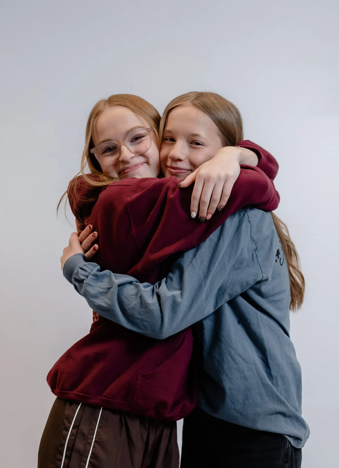 Syd Patzwald hugging a friend in the studio
