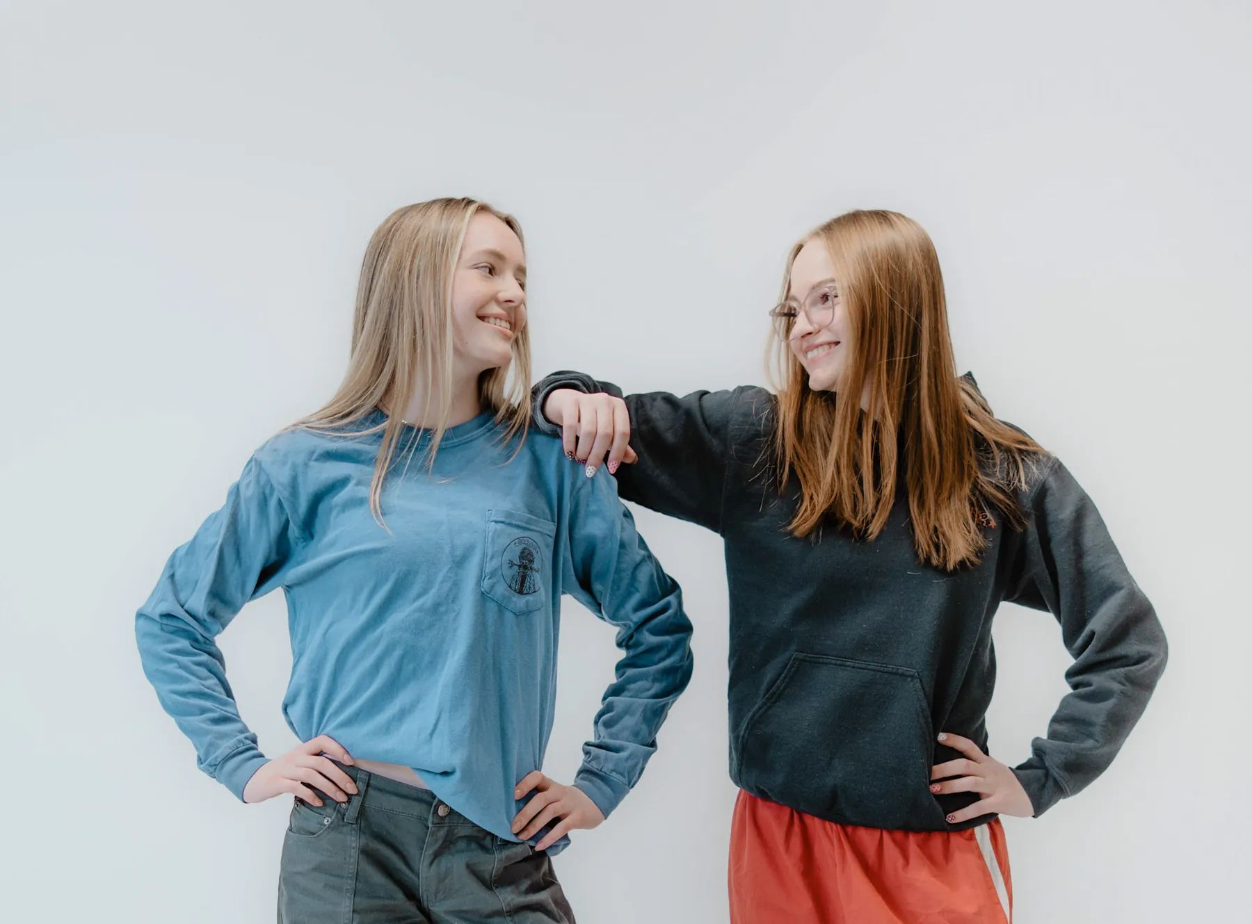 Syd Patzwald and a friend hands on hips in the studio