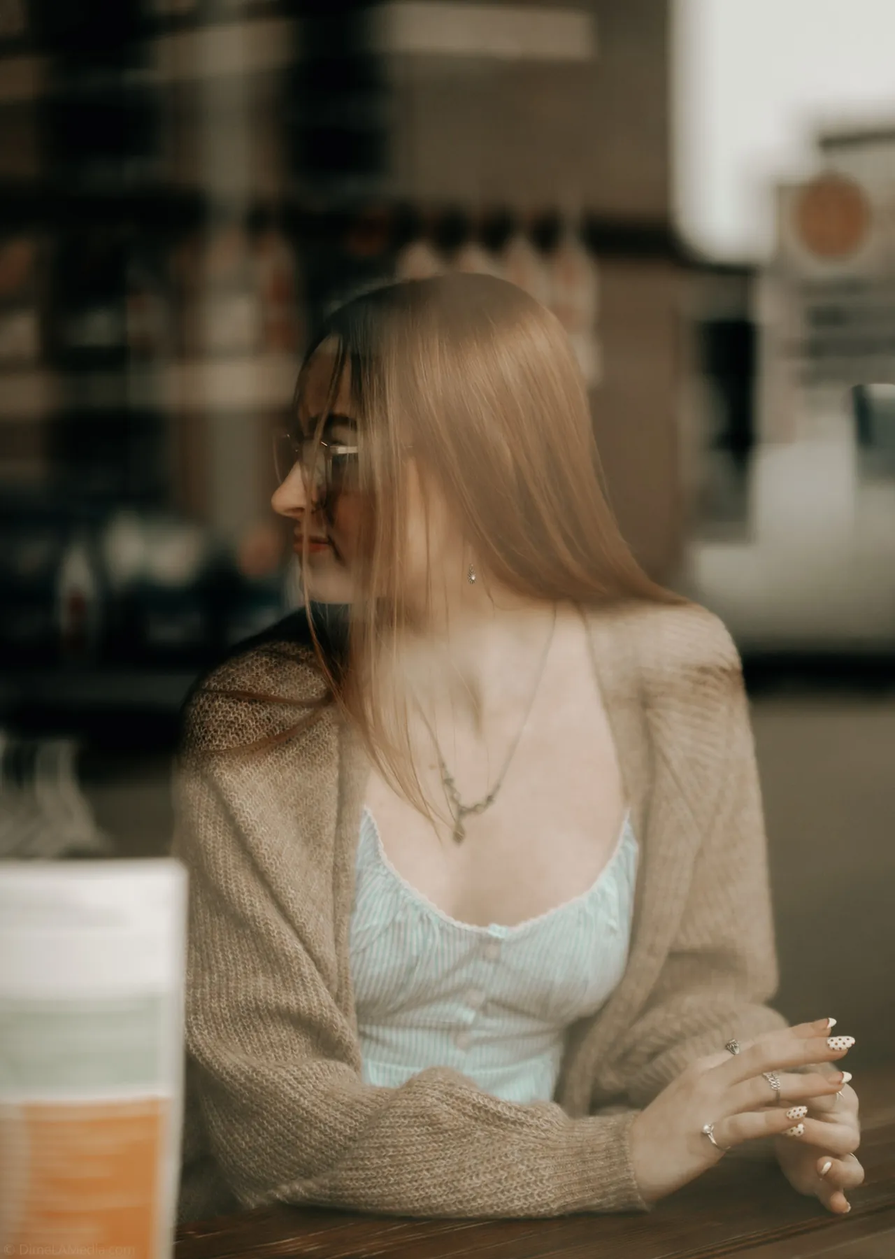 Syd Patzwald in golden window light at a downtown Sioux Falls cafe