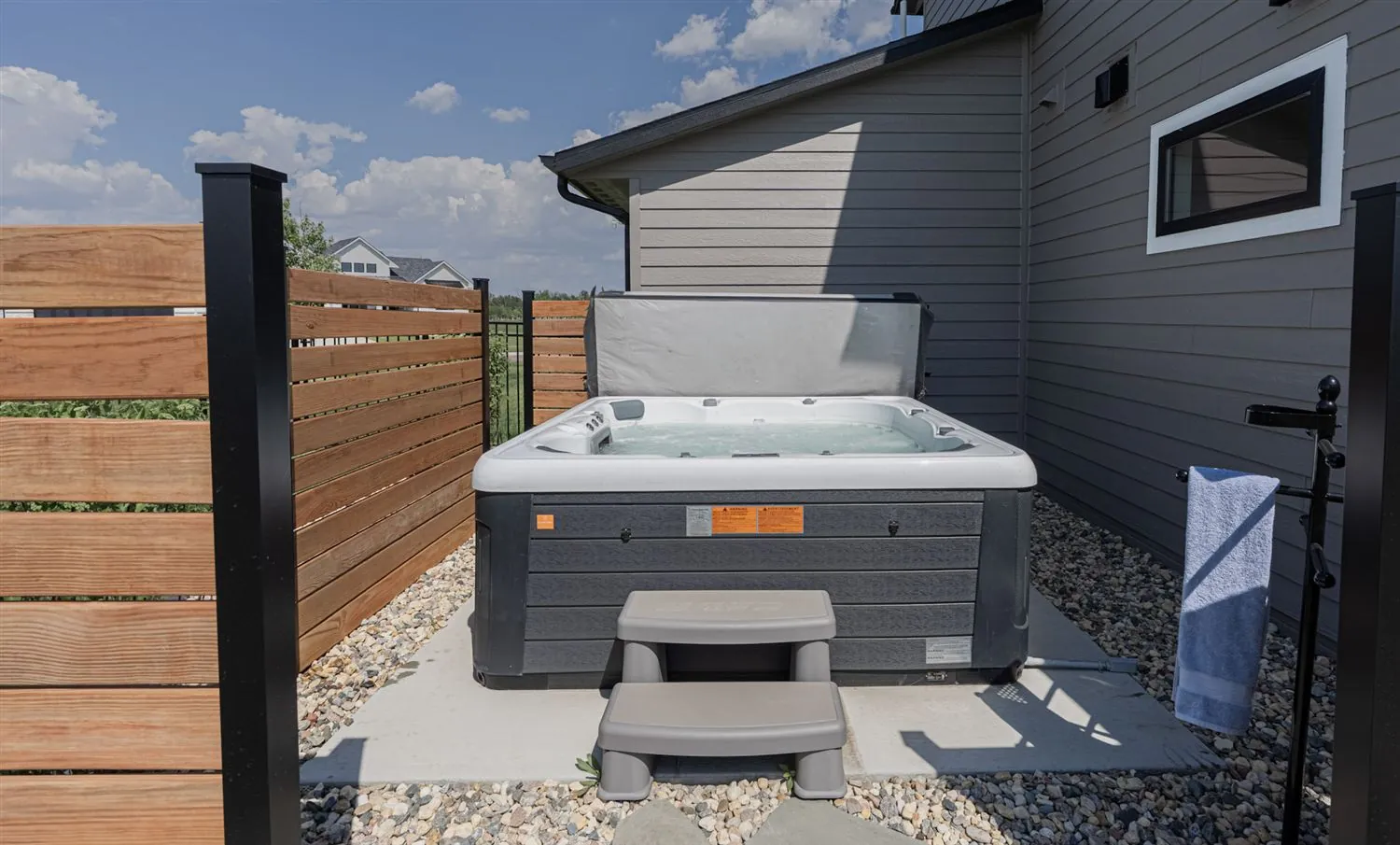 Backyard hot tub and privacy fence, real estate photography Sioux Falls SD