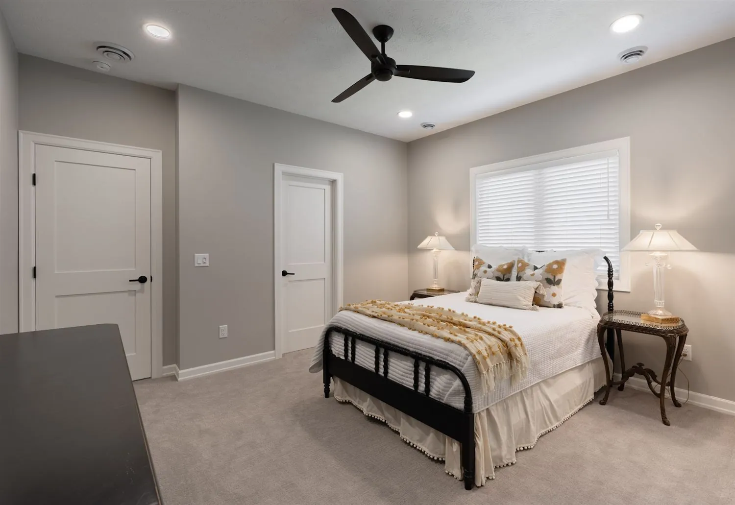 Bedroom with sitting area and ceiling fan, real estate photography Sioux Falls SD