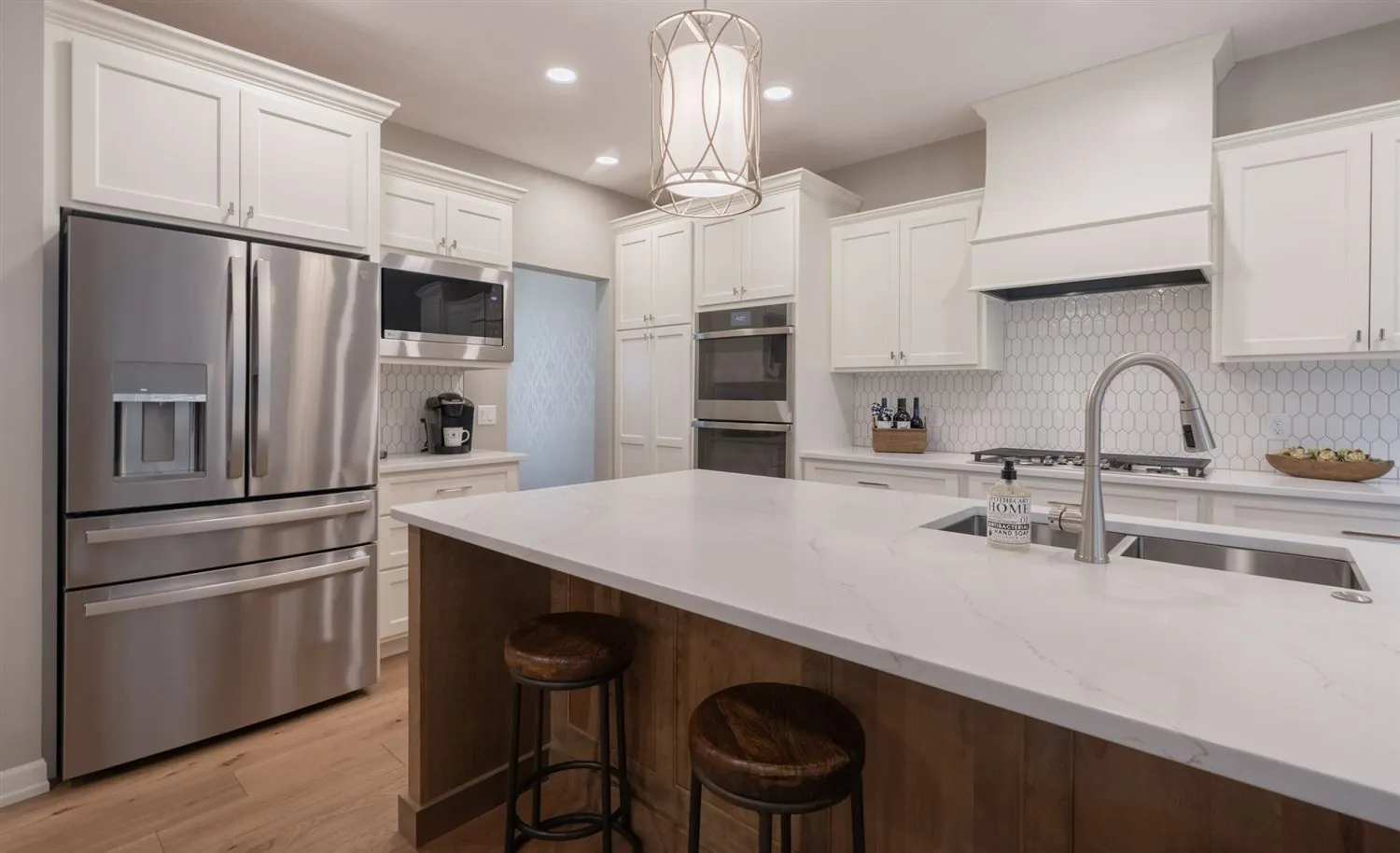 Kitchen opening to dining with chandelier, real estate photography Sioux Falls SD