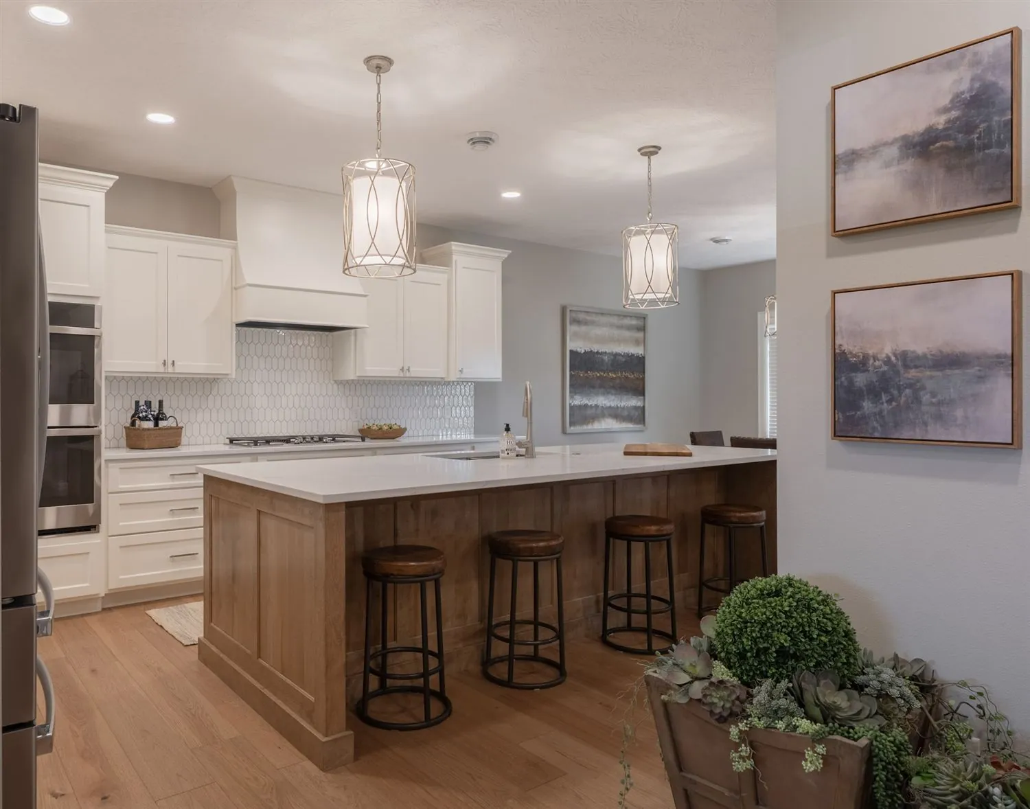 Kitchen with wood island and bar seating, real estate photography Sioux Falls SD