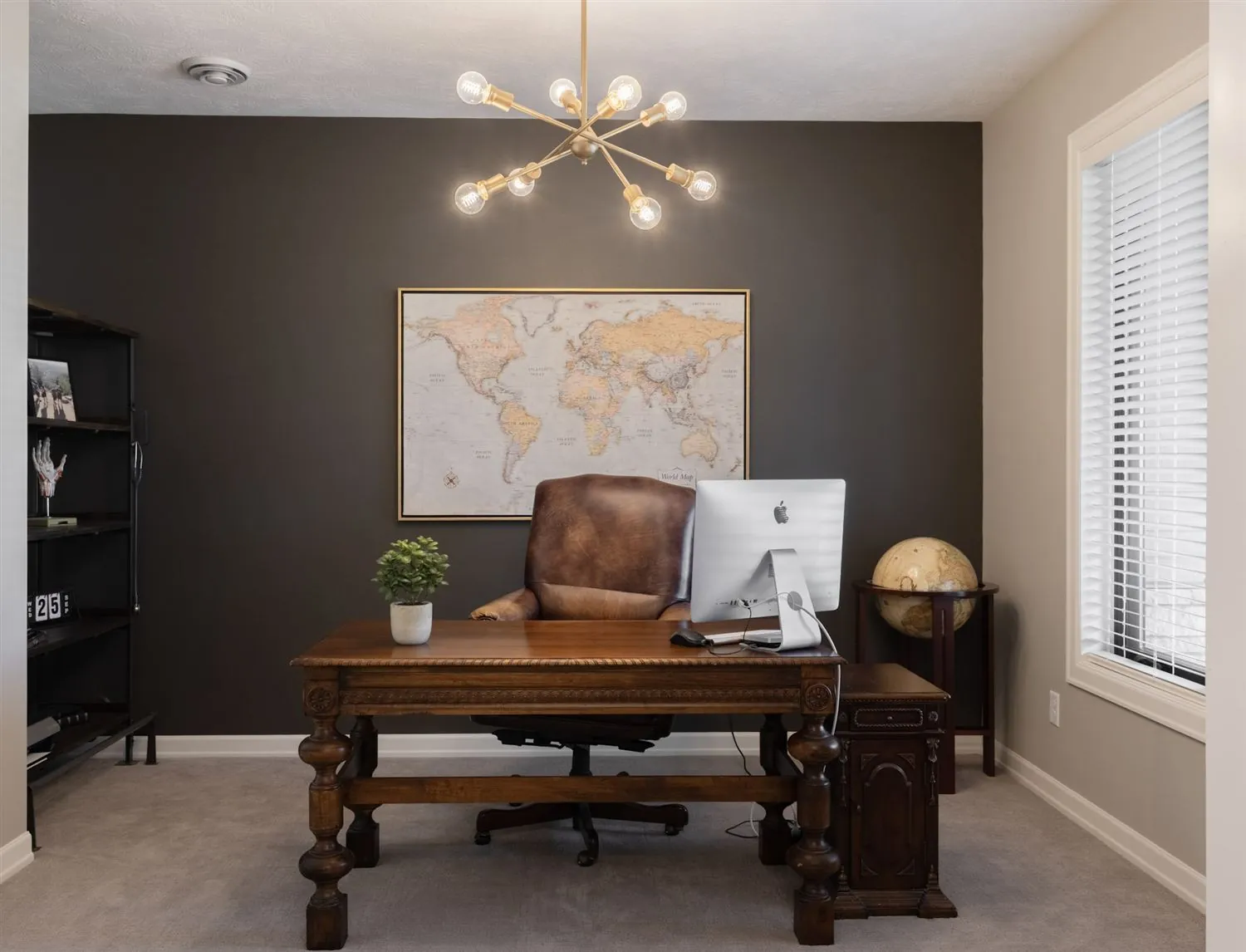 Home office with a dark accent wall and executive desk, real estate photography Sioux Falls SD