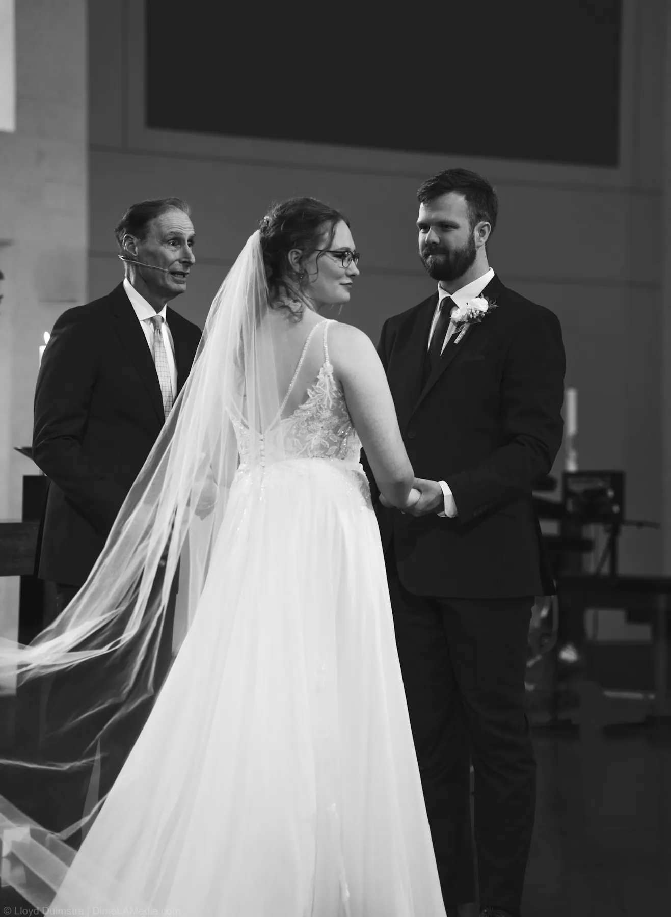Bride and groom at the altar with the officiant, Sioux Falls SD