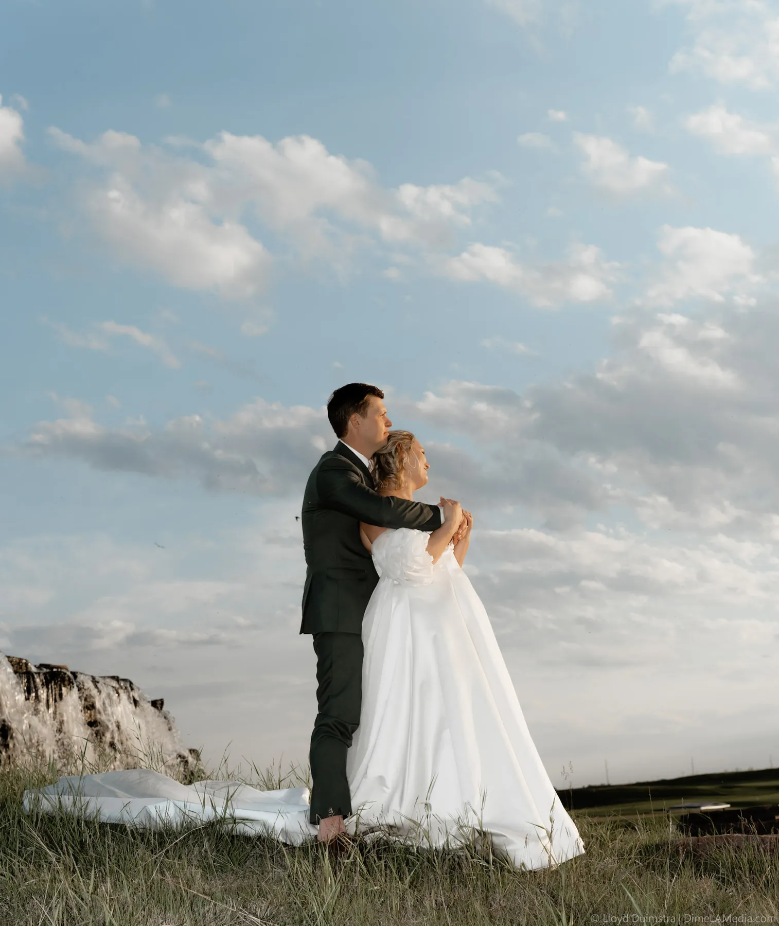 Couple embracing under a dramatic evening sky, Sioux Falls SD
